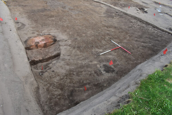 Ash-filled hearth uncovered within midden layers Ash-filled hearth uncovered within midden layers