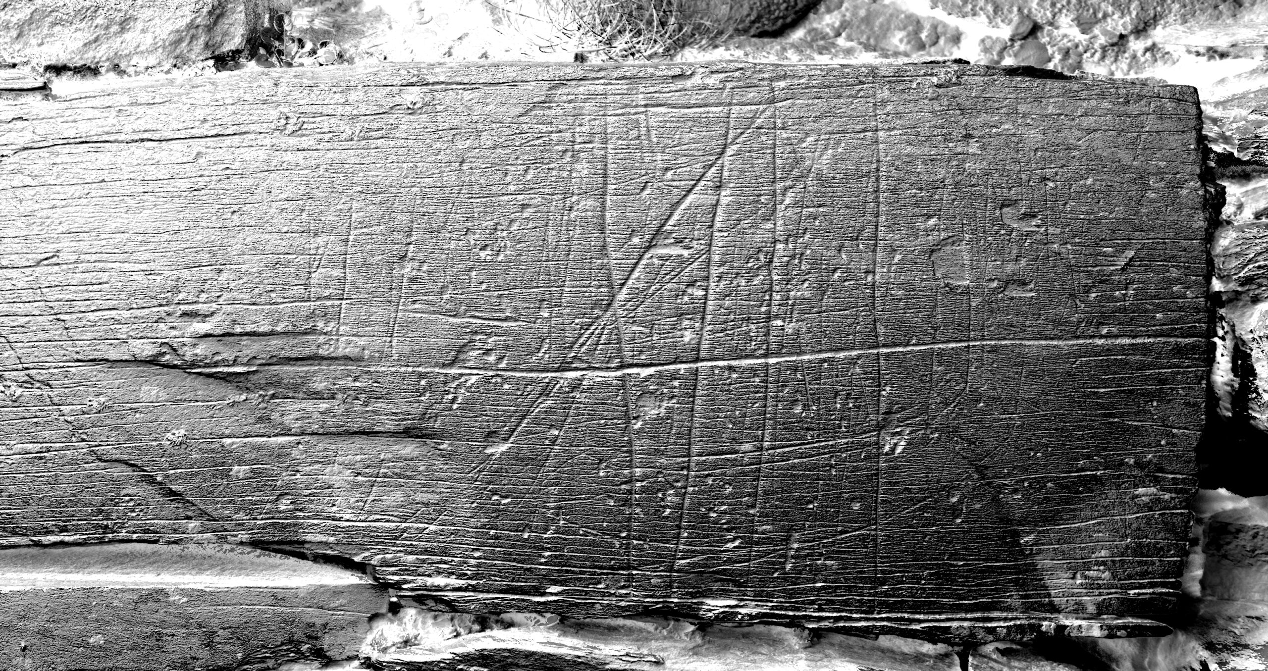 Stone with ship carvings and star or criss-cross symbol. Carvings highlighted using Reflectance Transformation Imaging (RTI).