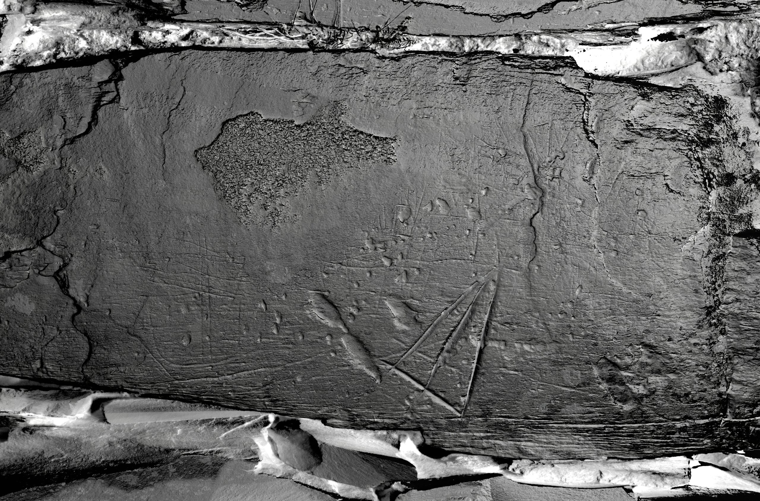 Ship carvings and incised triangle