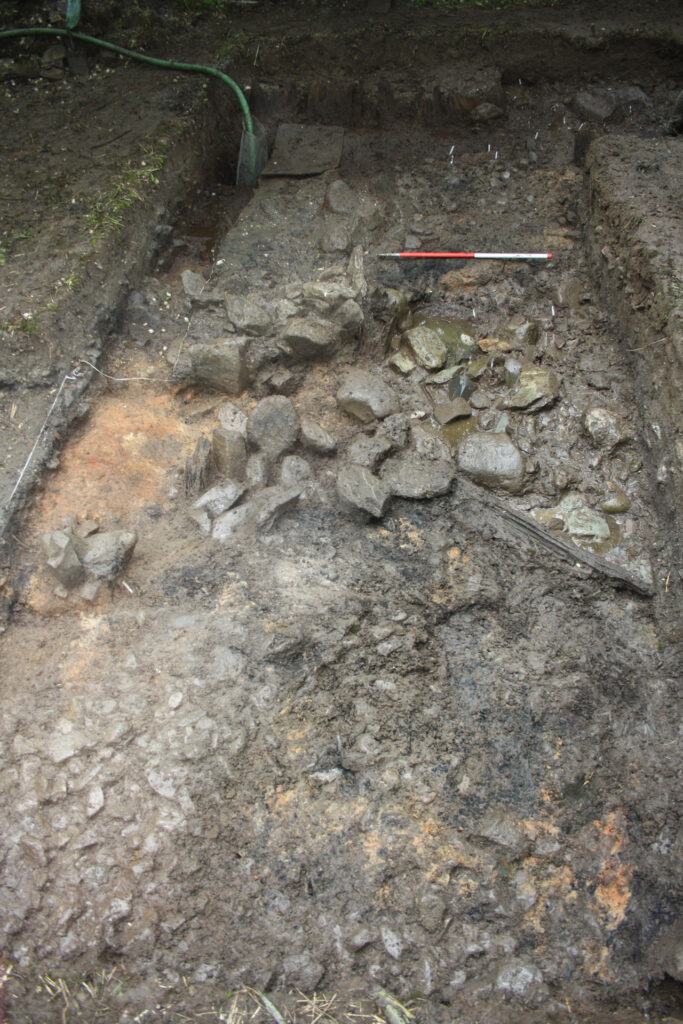The eastern terminal of Rampart 2 with tumbled stones from the revetment wall The eastern terminal of Rampart 2 with tumbled stones from the revetment wall