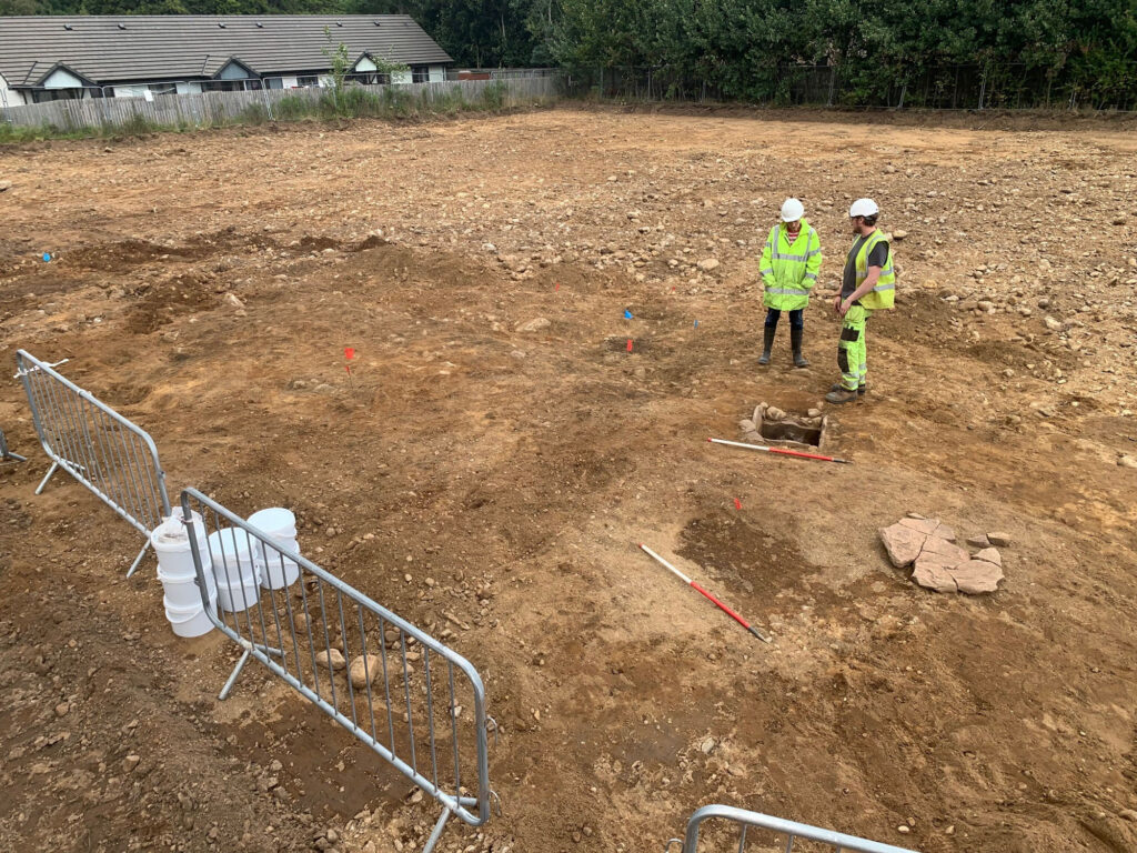 Archaeologists working on a Bronze Age cist Archaeologists working on a Bronze Age cist