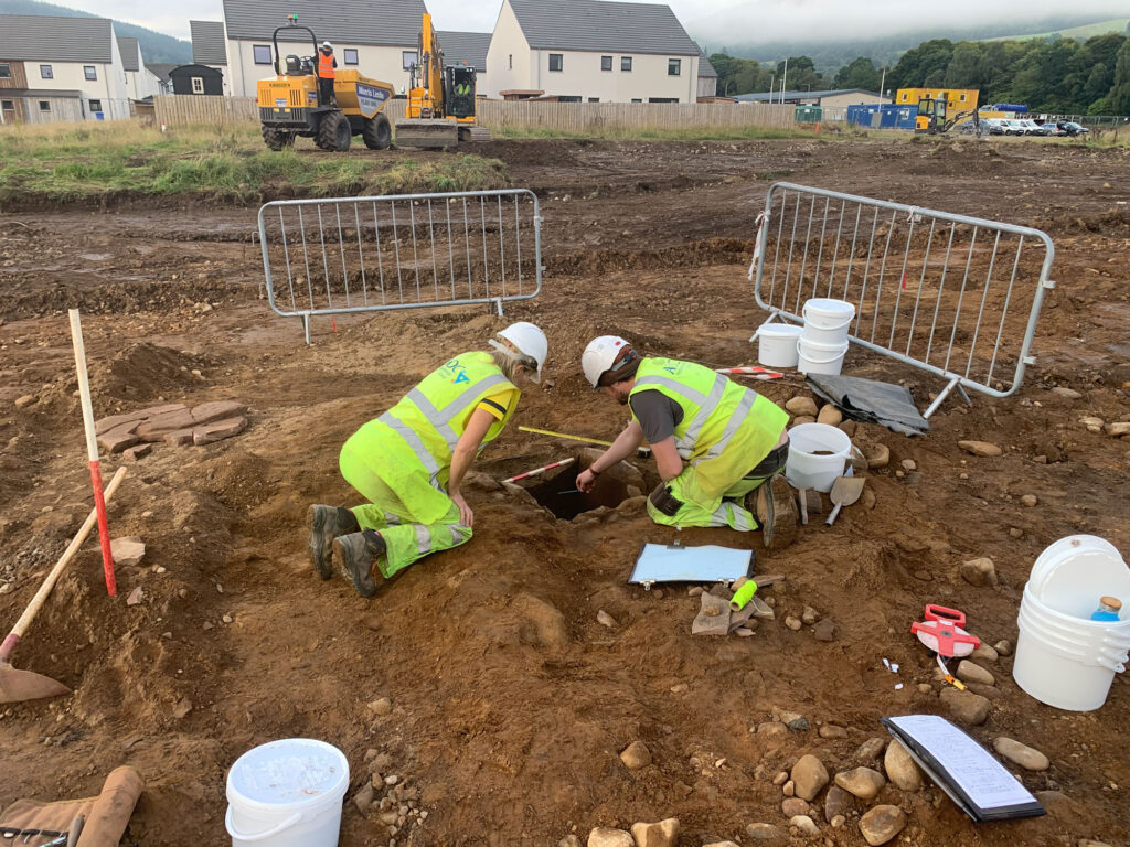 Archaeologists excavate a Bronze Age cist Archaeologists excavate a Bronze Age cist