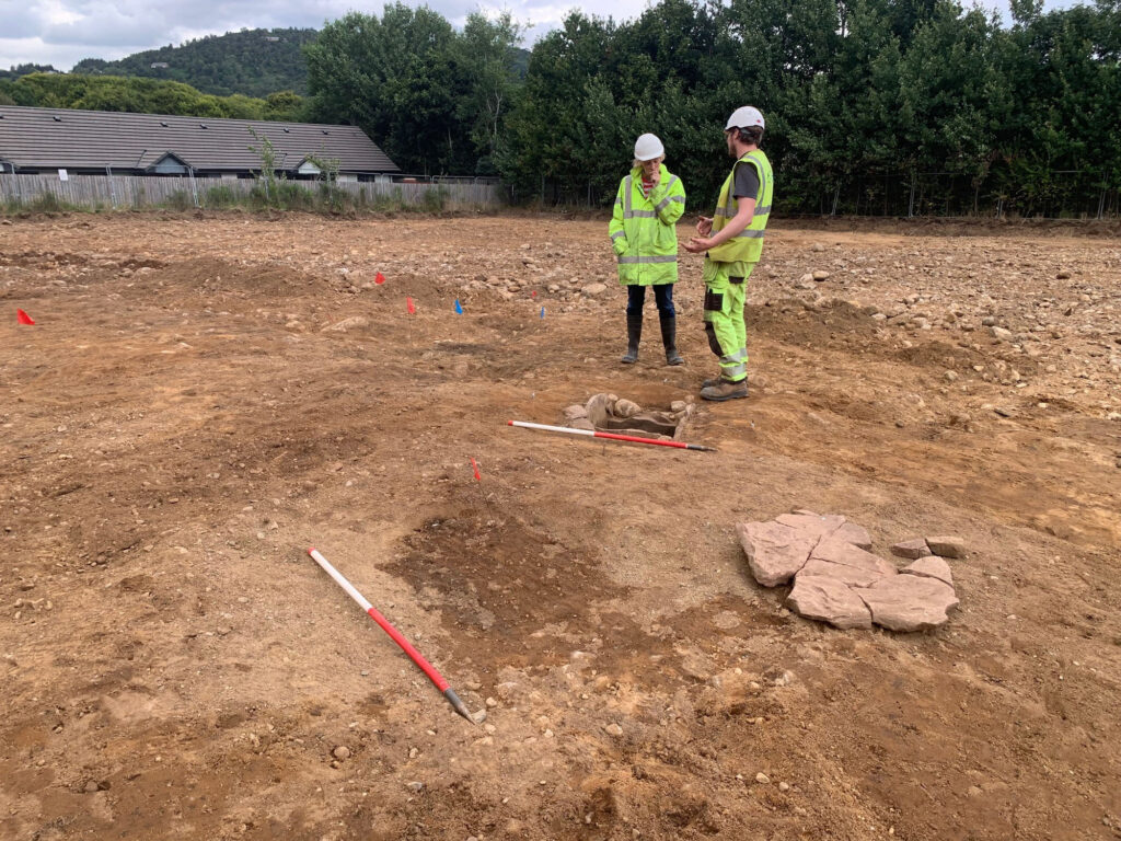 Archaeologists working on a Bronze Age cist Archaeologists working on a Bronze Age cist