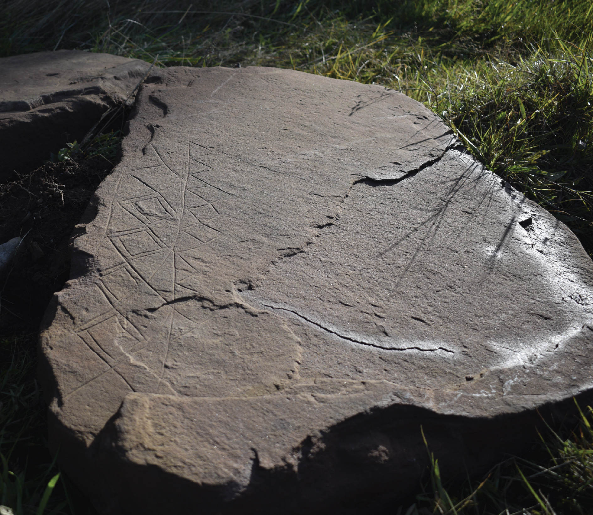 image of decorated slab with diamond and triangle designs