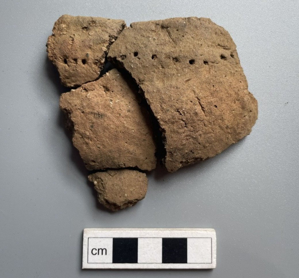 Neolithic pottery fragment with dot decoration