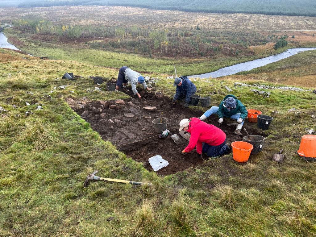 Excavation of a possible structure occupation deposit in the summit enclosure Excavation of a possible structure occupation deposit in the summit enclosure