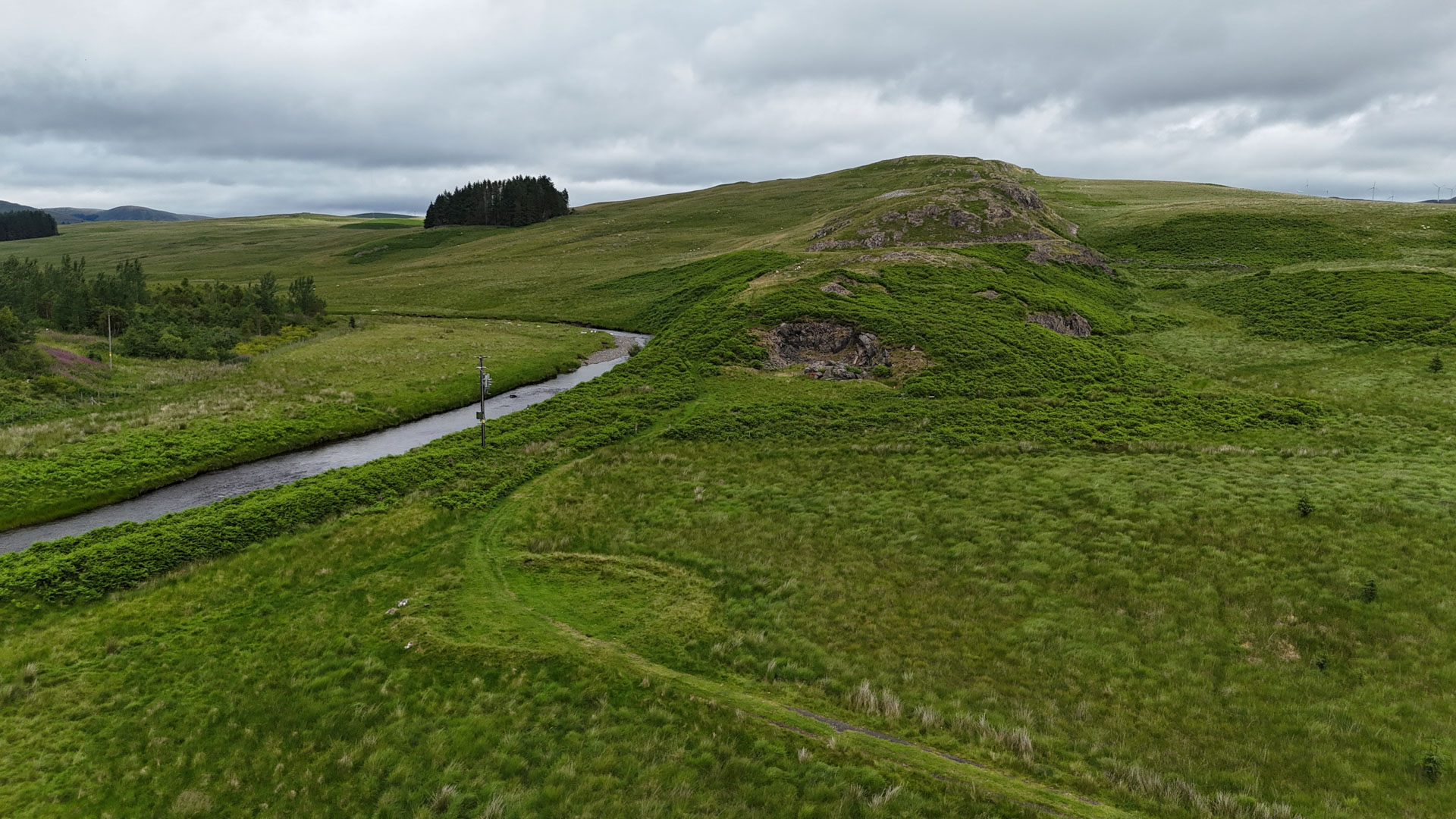 Stroanfreggan Craig hillfort with Smittons Bridge cairn in the foreground